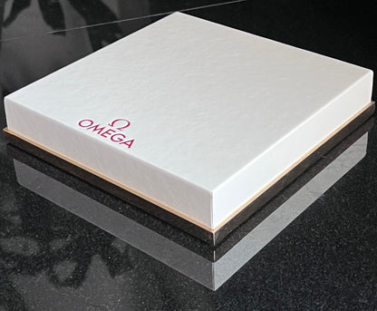 Omega Retail Display-Gold Base-White Leather-Embossed Iconic Red Omega Logo-Mint