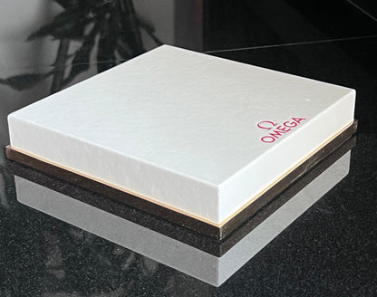 Omega Retail Display-Gold Base-White Leather-Embossed Iconic Red Omega Logo-Mint