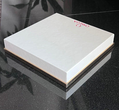 Omega Retail Display-Gold Base-White Leather-Embossed Iconic Red Omega Logo-Mint