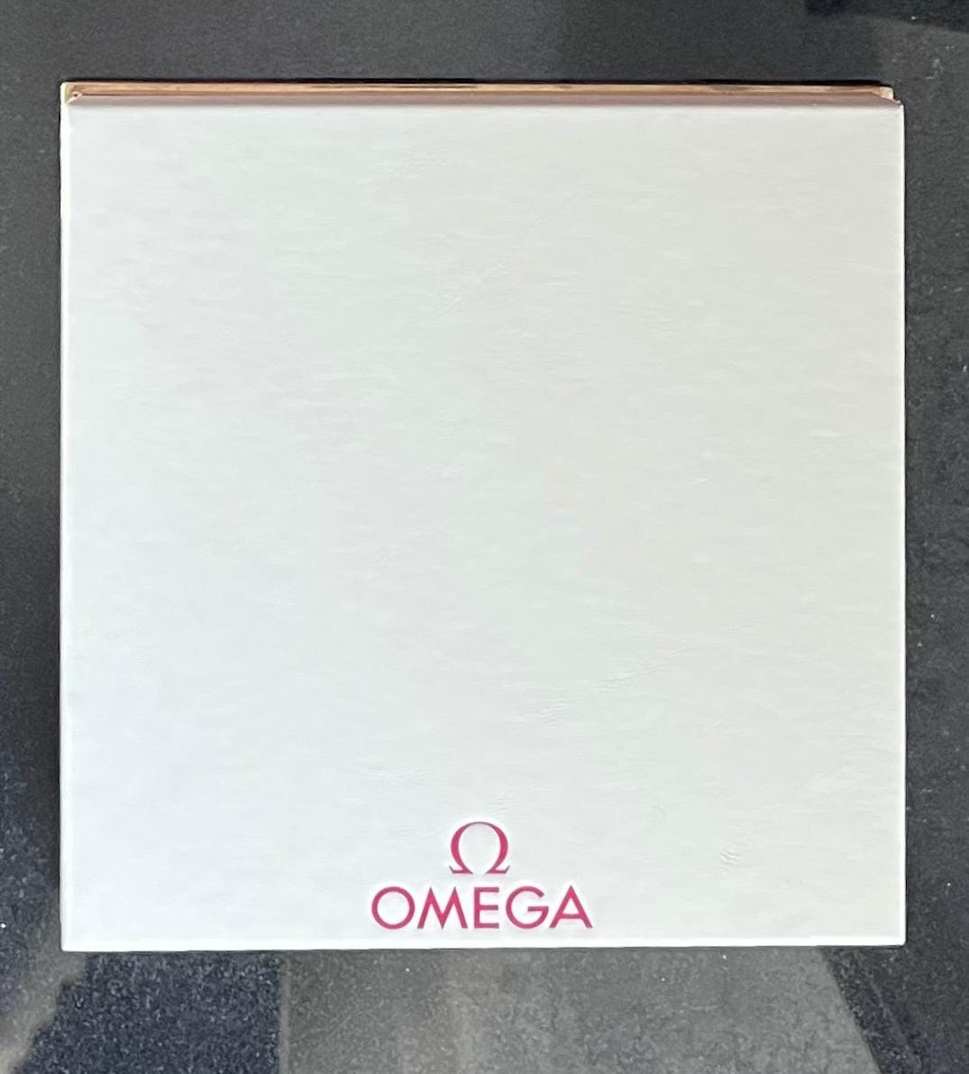 Omega Retail Display-Gold Base-White Leather-Embossed Iconic Red Omega Logo-Mint